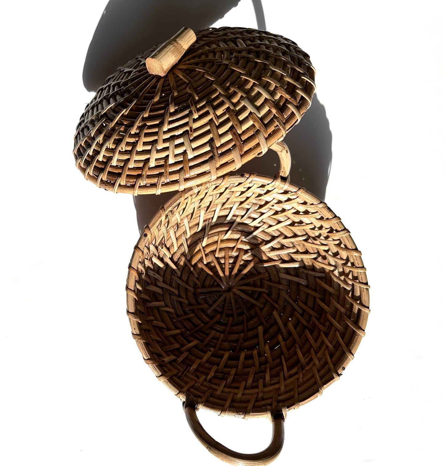 Cane roti box with handles and lid.